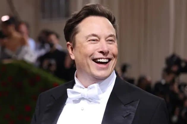 A well-known X.com personality laughing in a tuxedo